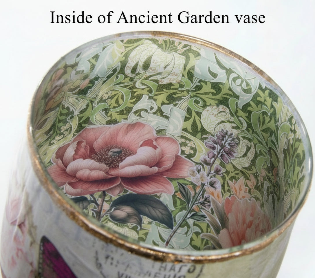 Close up of inside the Ancient Garden vase showing beautiful green paper with white flowers in the background with pink and purple flowers in the foreground.